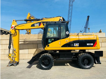 Escavadeira de rodas CATERPILLAR M318D