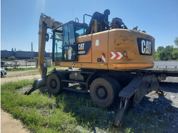 Escavadeira de rodas CATERPILLAR MH3024