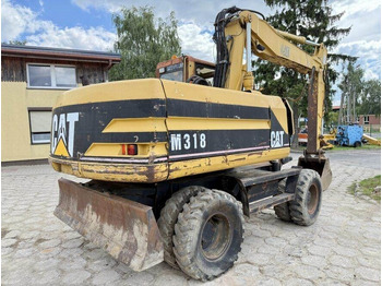 Escavadeira de rodas CATERPILLAR M318