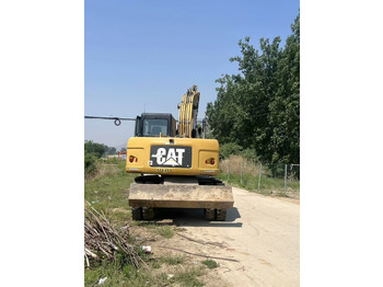 Escavadeira de rodas CATERPILLAR