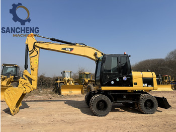 Escavadeira de rodas CATERPILLAR M320