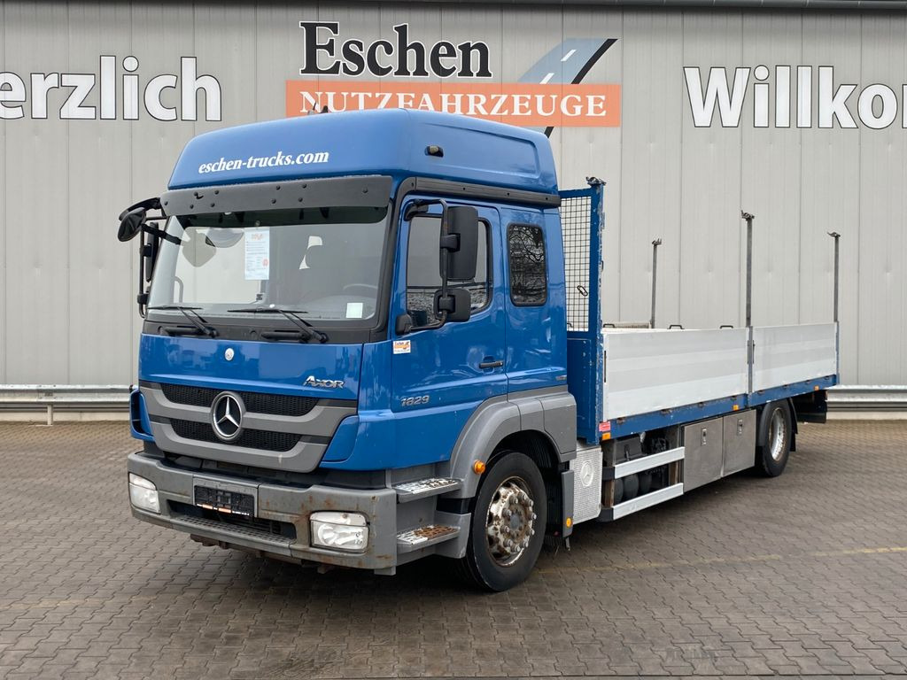 Mercedes-Benz Axor 1829 LL 6,55m Pritsche*6 Sitze*Klima*AHK - Camião de caixa aberta/ Plataforma: foto 1 Mercedes-Benz Axor 1829 LL 6,55m Pritsche*6 Sitze*Klima*AHK - Camião de caixa aberta/ Plataforma: foto 1