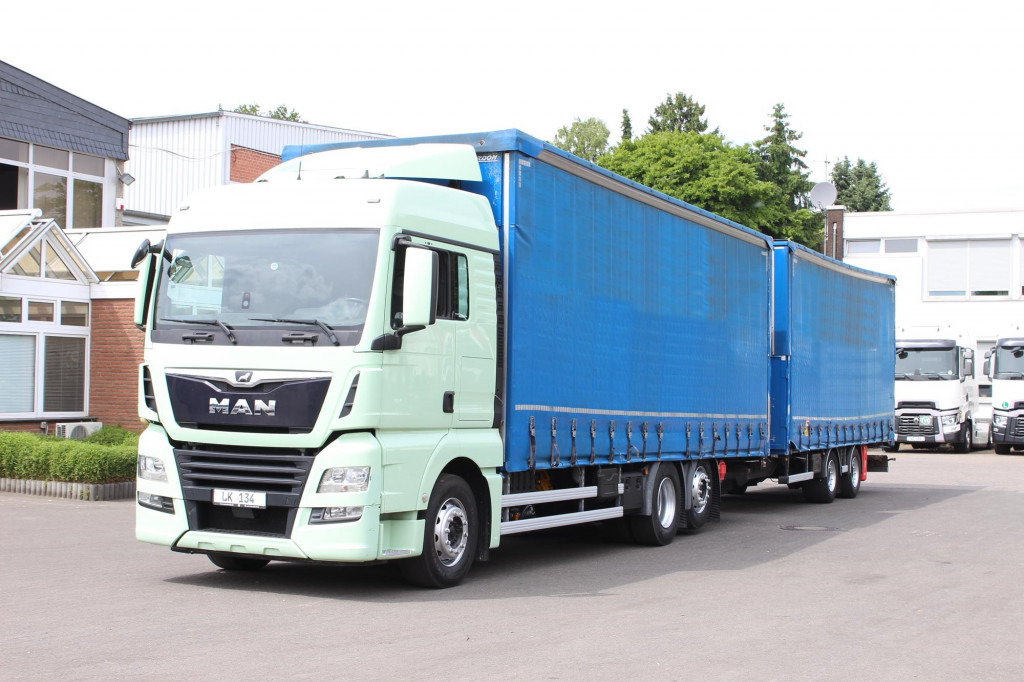 MAN TGX26.460 Durchlad Plane-Jumbo Retarder Hubdach - Camião de lona: foto 1 MAN TGX26.460 Durchlad Plane-Jumbo Retarder Hubdach - Camião de lona: foto 1