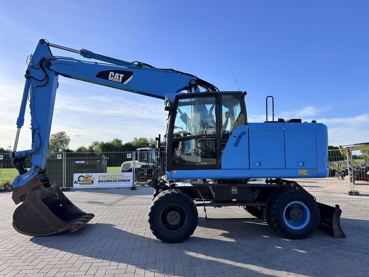 CATERPILLAR M 318 F Oil Quick OQ 65 Deutsche Maschine Top ! - Escavadeira de rodas: foto 1 CATERPILLAR M 318 F Oil Quick OQ 65 Deutsche Maschine Top ! - Escavadeira de rodas: foto 1