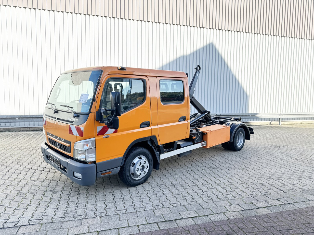 Mitsubishi Canter Fuso 6C15D 4x2 Doka Canter Fuso 6C15D 4x2 Doka, City-Abroller - Camião polibenne: foto 1 Mitsubishi Canter Fuso 6C15D 4x2 Doka Canter Fuso 6C15D 4x2 Doka, City-Abroller - Camião polibenne: foto 1