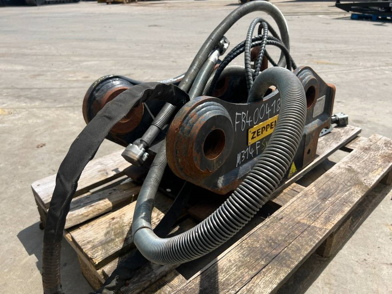 OilQuick OQ65 - M314F / M316F / M318F - Acoplamento rápido por Máquina de construção: foto 5 OilQuick OQ65 - M314F / M316F / M318F - Acoplamento rápido por Máquina de construção: foto 5