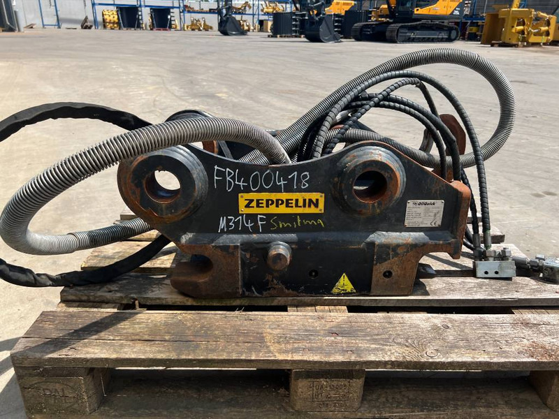 OilQuick OQ65 - M314F / M316F / M318F - Acoplamento rápido por Máquina de construção: foto 4 OilQuick OQ65 - M314F / M316F / M318F - Acoplamento rápido por Máquina de construção: foto 4