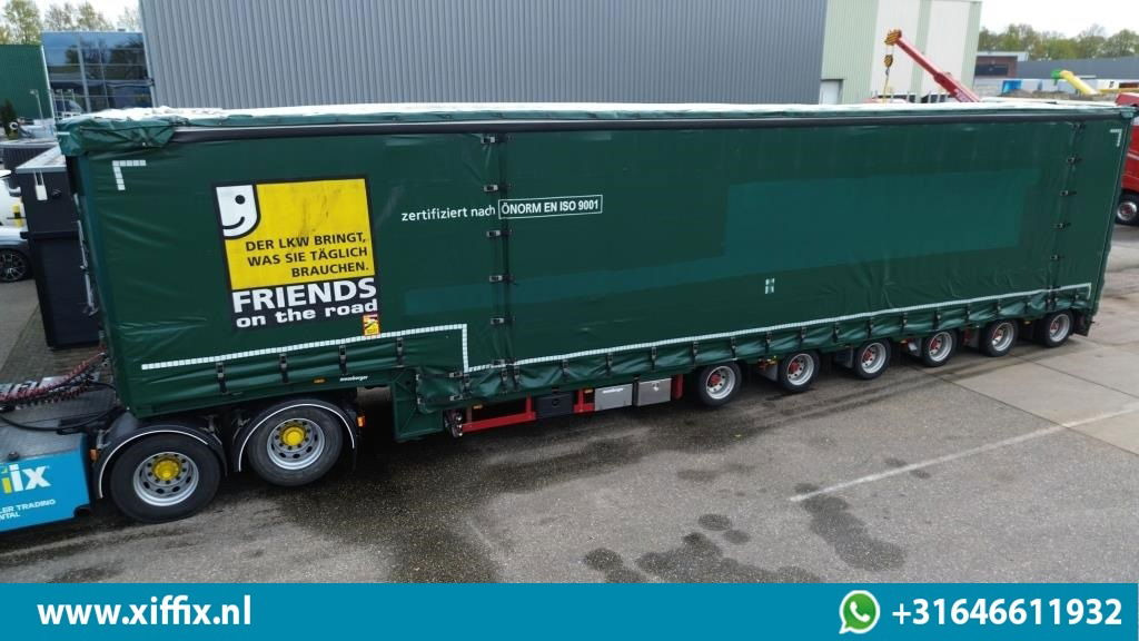 Meusburger 6-ass. Semi dieplader met elektrische huifopbouw / 3x naloop gestuurd - Semi-reboque baixa: foto 1 Meusburger 6-ass. Semi dieplader met elektrische huifopbouw / 3x naloop gestuurd - Semi-reboque baixa: foto 1