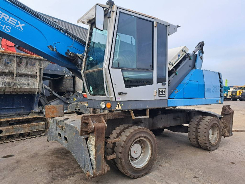 Fuchs MHL 335 - Manipulador de material: foto 4 Fuchs MHL 335 - Manipulador de material: foto 4