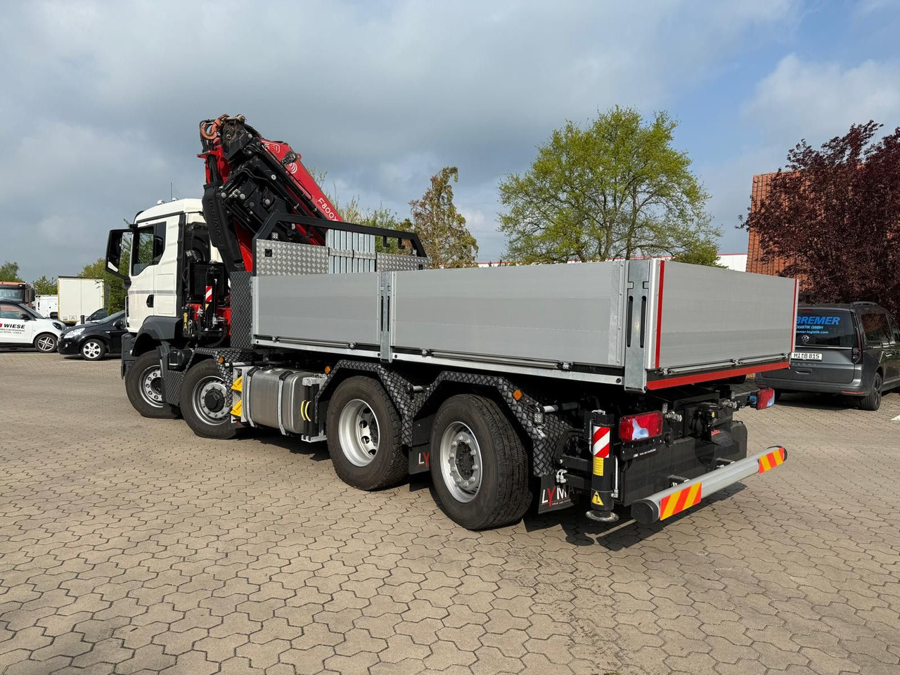MAN 35.520 8x4 mit Kran Fassi F800 RA2.28 - Camião de caixa aberta/ Plataforma, Camião grua: foto 1 MAN 35.520 8x4 mit Kran Fassi F800 RA2.28 - Camião de caixa aberta/ Plataforma, Camião grua: foto 1