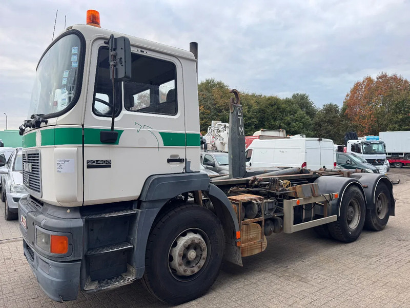 MAN 33.403 **BELGIAN TRUCK-FULL STEEL-MANUAL PUMP** - Camião polibenne: foto 1 MAN 33.403 **BELGIAN TRUCK-FULL STEEL-MANUAL PUMP** - Camião polibenne: foto 1