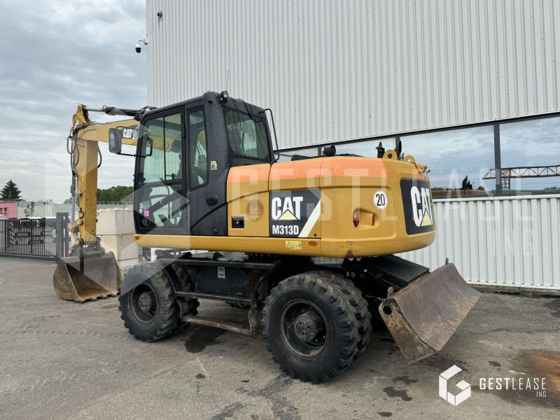 Caterpillar M313D - Escavadeira de rodas: foto 2 Caterpillar M313D - Escavadeira de rodas: foto 2