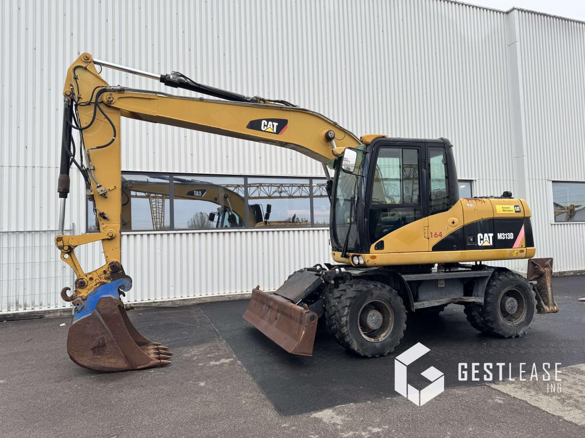 Caterpillar M313D Mono - Escavadeira de rodas: foto 1 Caterpillar M313D Mono - Escavadeira de rodas: foto 1