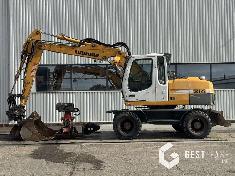 Liebherr A314 Litronic - Escavadeira de rodas: foto 2 Liebherr A314 Litronic - Escavadeira de rodas: foto 2