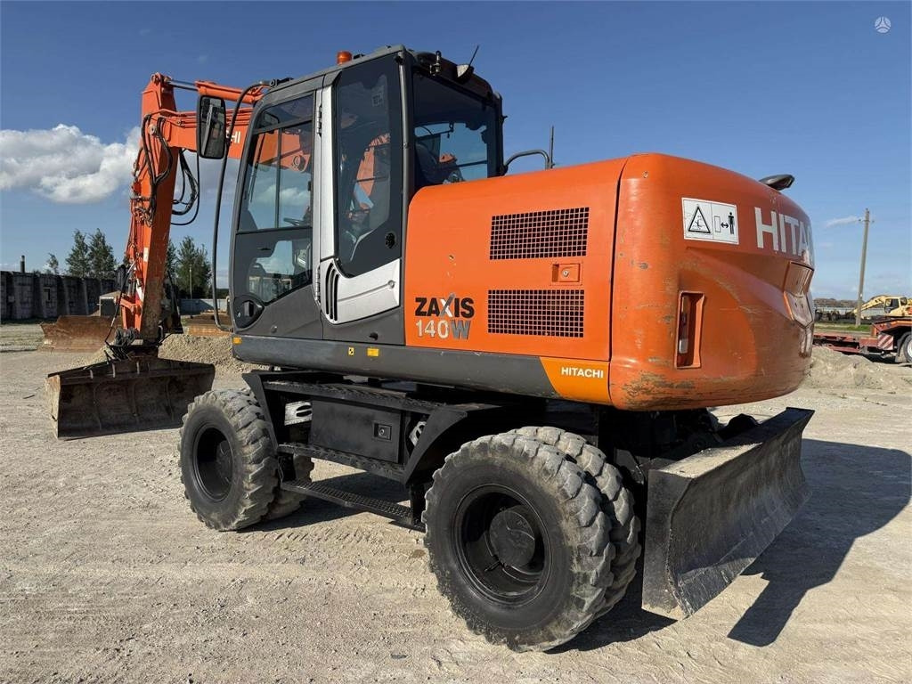 Hitachi ZX 140 W - Escavadeira de rodas: foto 1 Hitachi ZX 140 W - Escavadeira de rodas: foto 1