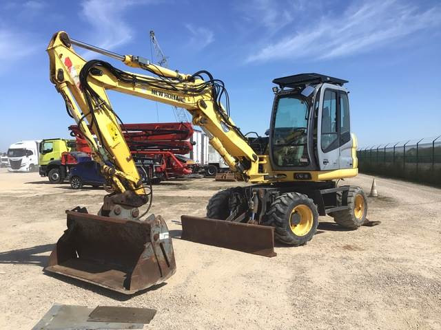 New Holland MH2.6 - Escavadeira de rodas: foto 1 New Holland MH2.6 - Escavadeira de rodas: foto 1