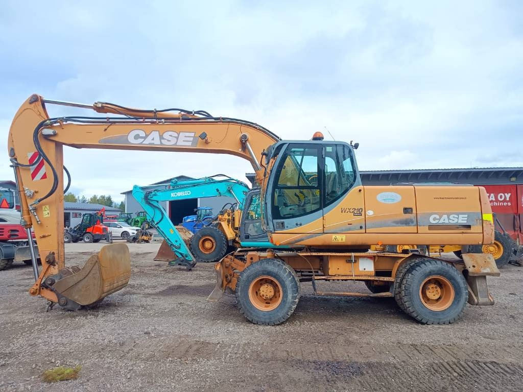Case WX210 PYÖRITTÄJÄLLÄ  - Escavadeira de rodas: foto 1 Case WX210 PYÖRITTÄJÄLLÄ  - Escavadeira de rodas: foto 1
