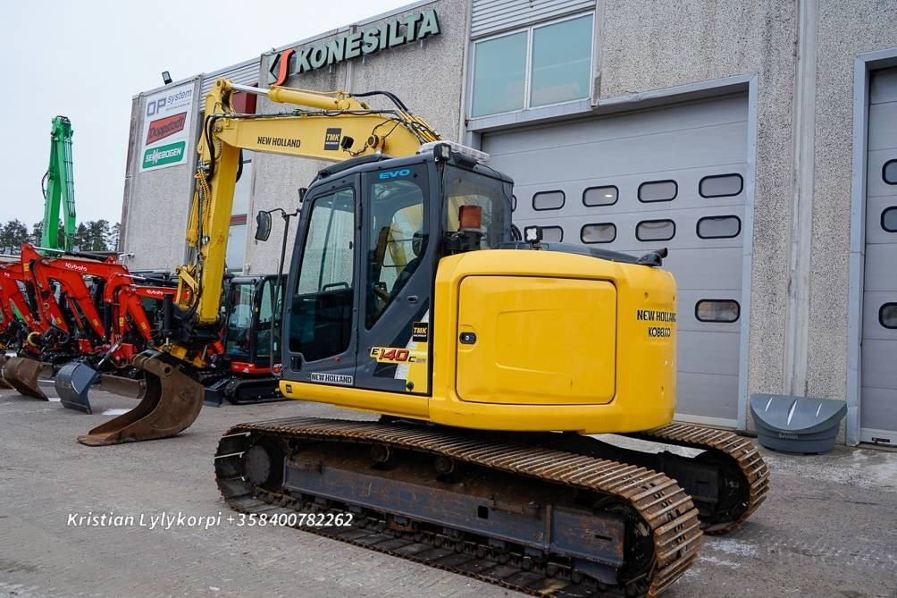 New Holland E140CSR PYÖRITTÄJÄLLÄ - Escavadora de rastos: foto 2 New Holland E140CSR PYÖRITTÄJÄLLÄ - Escavadora de rastos: foto 2