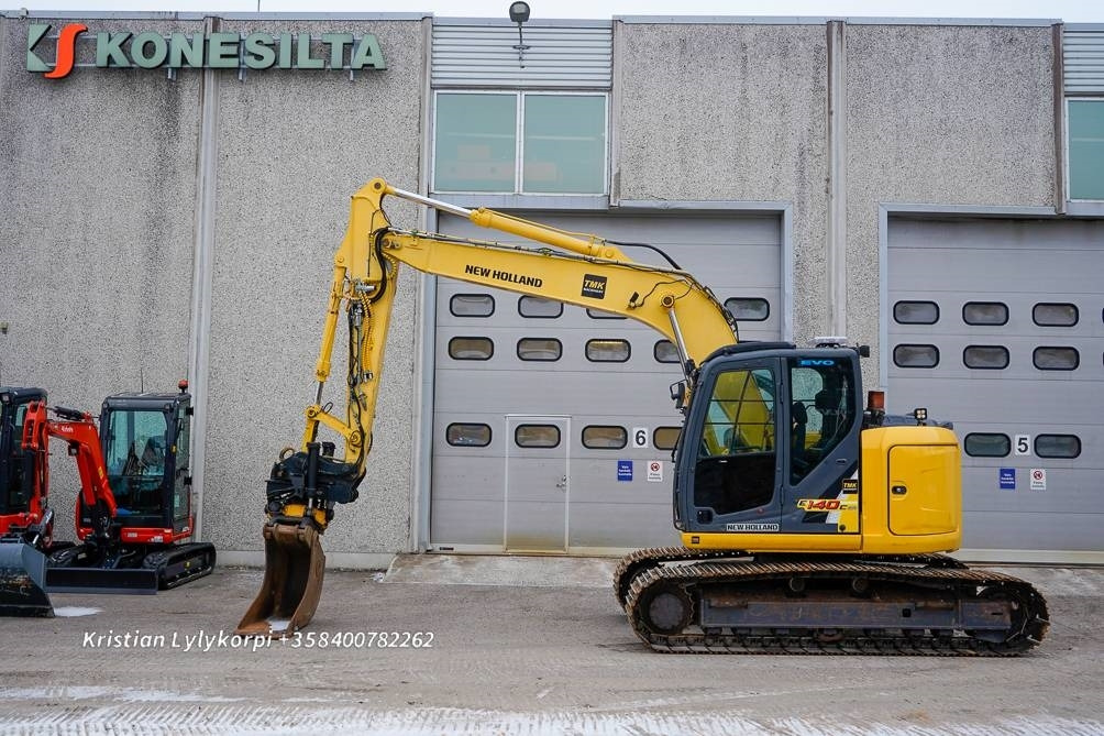 New Holland E140CSR PYÖRITTÄJÄLLÄ - Escavadora de rastos: foto 1 New Holland E140CSR PYÖRITTÄJÄLLÄ - Escavadora de rastos: foto 1