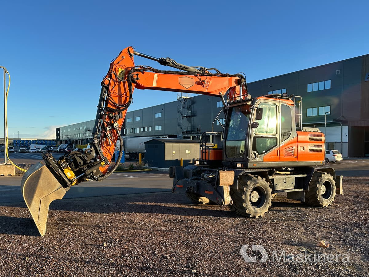 Hjulgrävare Doosan DX160W-5 - Escavadora de rastos: foto 1 Hjulgrävare Doosan DX160W-5 - Escavadora de rastos: foto 1