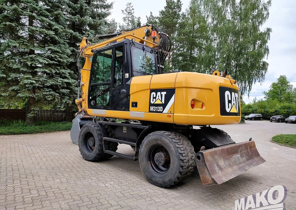 Caterpillar M313D - Escavadeira de rodas: foto 2 Caterpillar M313D - Escavadeira de rodas: foto 2