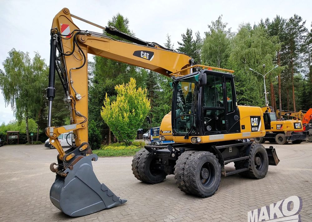 Escavadeira de rodas Caterpillar M313D: foto 7
