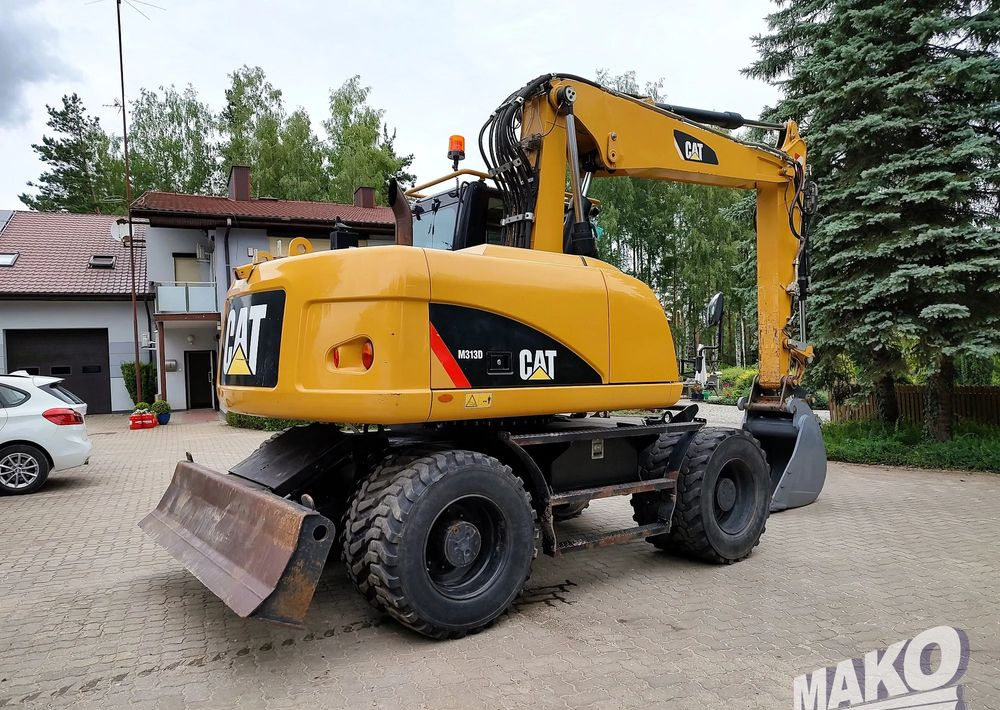 Caterpillar M313D - Escavadeira de rodas: foto 4 Caterpillar M313D - Escavadeira de rodas: foto 4