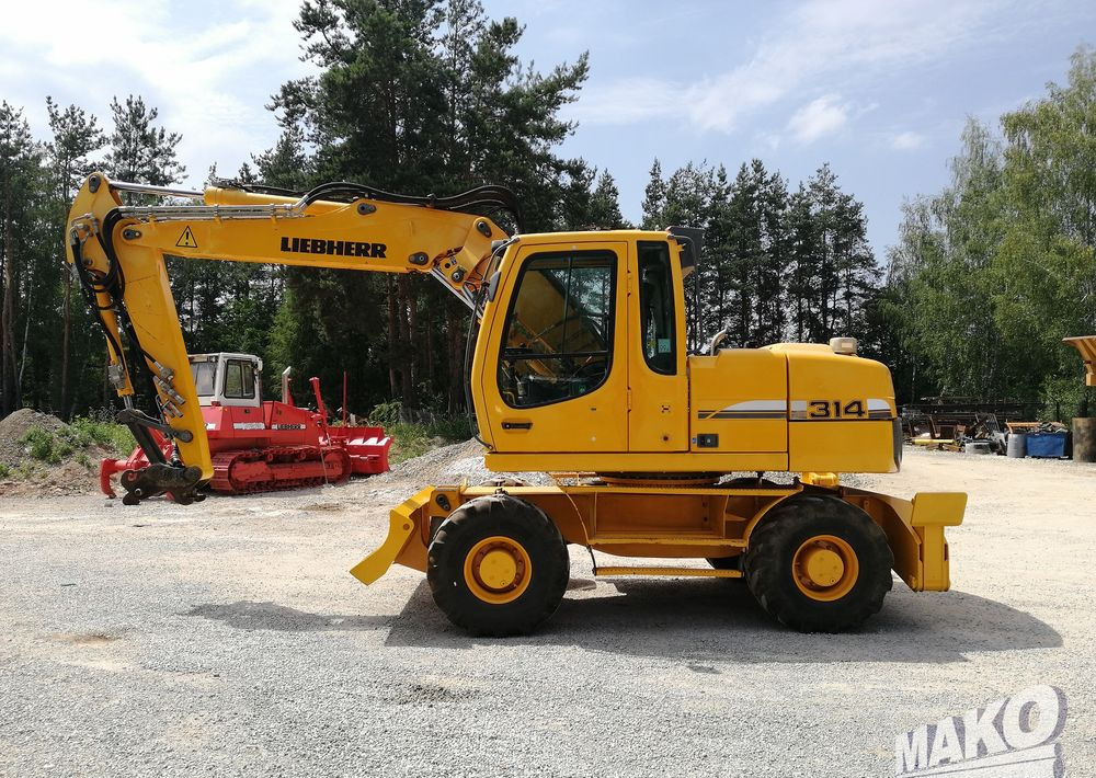 Liebherr A 314 Litronic - Escavadeira de rodas: foto 2 Liebherr A 314 Litronic - Escavadeira de rodas: foto 2