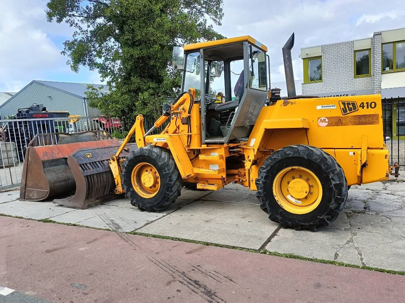 JCB 410 shovel wiellader loader + 2 bakken 4x4 robuust - Pá carregadora de rodas: foto 1 JCB 410 shovel wiellader loader + 2 bakken 4x4 robuust - Pá carregadora de rodas: foto 1