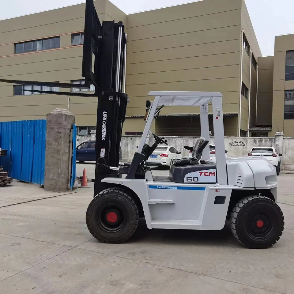 TCM 6 ton Diesel Forklift FD60 with Fork Positioner - Empilhadeira a diesel: foto 1 TCM 6 ton Diesel Forklift FD60 with Fork Positioner - Empilhadeira a diesel: foto 1