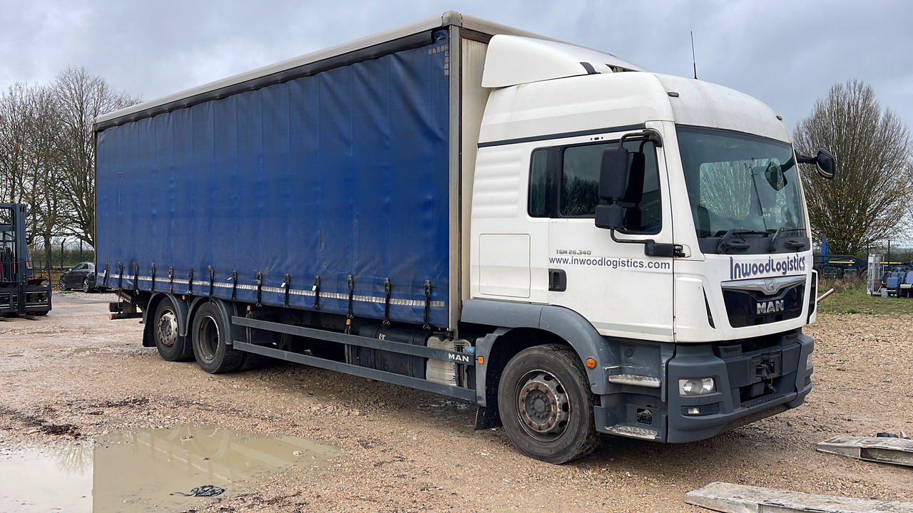 MAN TGM 26.340 - Camião de lona: foto 1 MAN TGM 26.340 - Camião de lona: foto 1