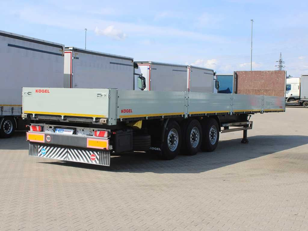 Kögel SN 24, LIFTING AXLE, MULTILOCK, SIDEWALLS - Semi-reboque plataforma/ Caixa aberta: foto 3 Kögel SN 24, LIFTING AXLE, MULTILOCK, SIDEWALLS - Semi-reboque plataforma/ Caixa aberta: foto 3