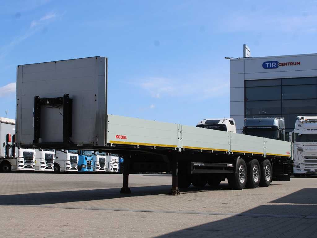 Kögel SN 24, LIFTING AXLE, MULTILOCK, SIDEWALLS - Semi-reboque plataforma/ Caixa aberta: foto 1 Kögel SN 24, LIFTING AXLE, MULTILOCK, SIDEWALLS - Semi-reboque plataforma/ Caixa aberta: foto 1