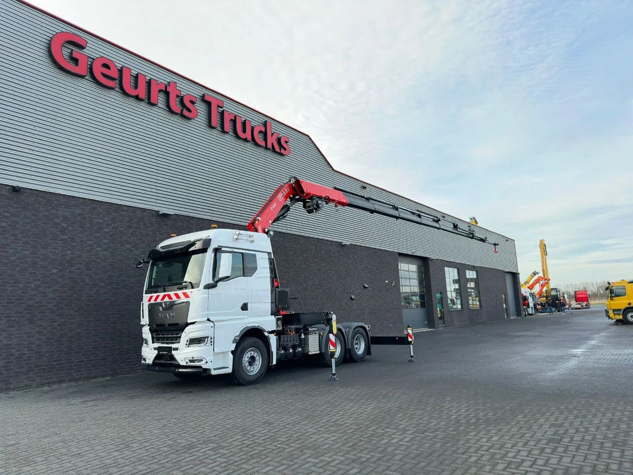 MAN TGX 33.520 6X4 TREKKER-BAKWAGEN COMBI + FASSI F4 - Camião grua: foto 2 MAN TGX 33.520 6X4 TREKKER-BAKWAGEN COMBI + FASSI F4 - Camião grua: foto 2