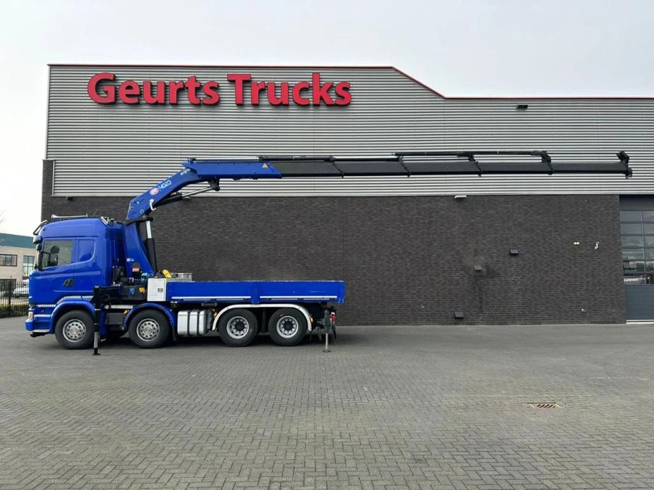 Scania R580 V8 8X4 TREKKER-BAKWAGEN COMBI + HMF 4020-K5 - Camião grua: foto 1 Scania R580 V8 8X4 TREKKER-BAKWAGEN COMBI + HMF 4020-K5 - Camião grua: foto 1