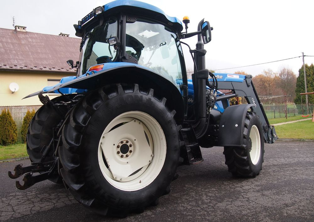 Ciągnik New Holland NH TS125A 6 cylindrów 2004 Ciągnik rolniczy New Holland TS125A - Trator: foto 4 Ciągnik New Holland NH TS125A 6 cylindrów 2004 Ciągnik rolniczy New Holland TS125A - Trator: foto 4