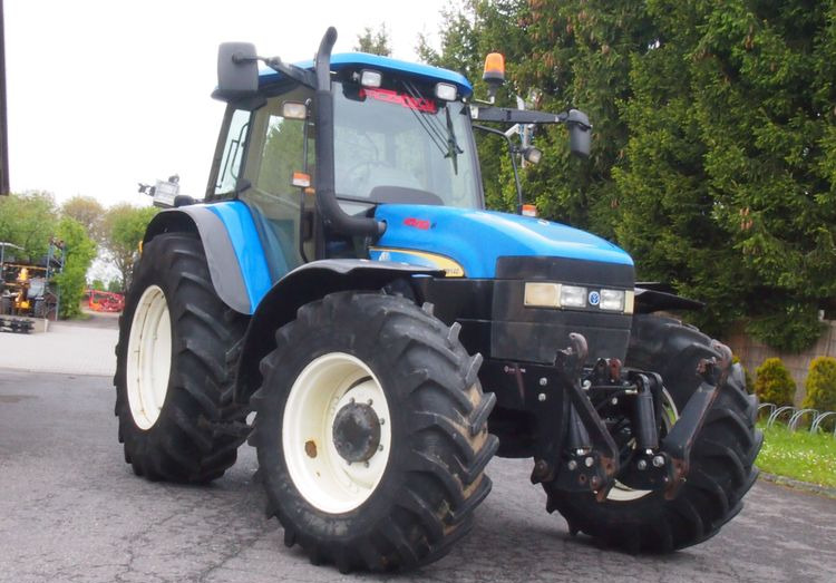 Ciągnik New Holland TM 140 2004 Przedni TUZ - Trator: foto 2 Ciągnik New Holland TM 140 2004 Przedni TUZ - Trator: foto 2