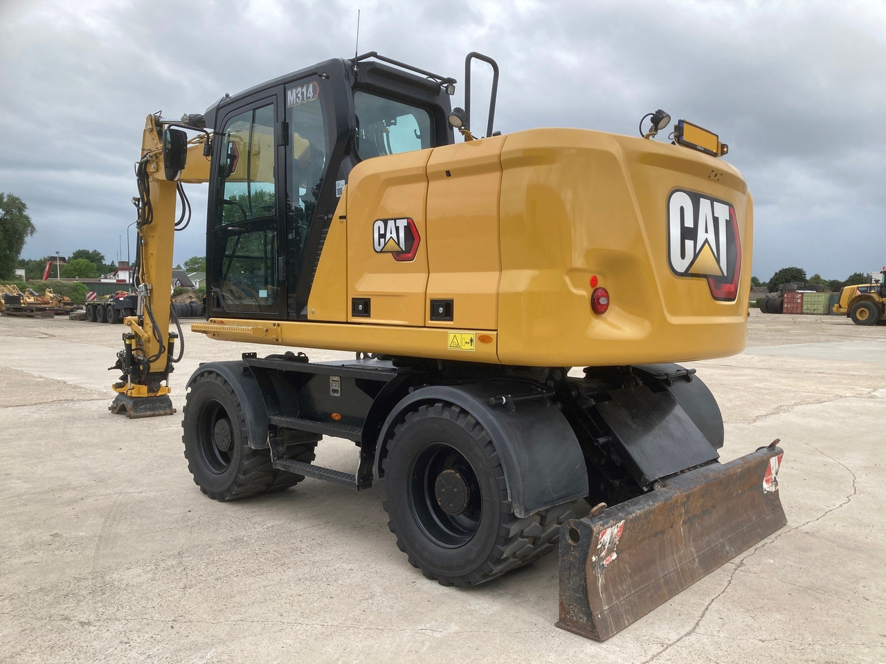 CATERPILLAR M314 - Escavadeira de rodas: foto 1 CATERPILLAR M314 - Escavadeira de rodas: foto 1