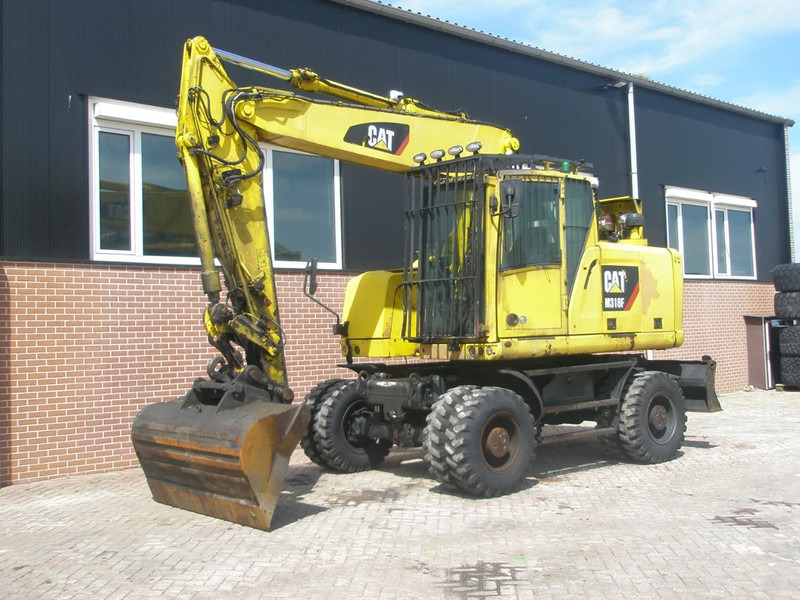 Caterpillar M318F - Escavadeira de rodas: foto 1 Caterpillar M318F - Escavadeira de rodas: foto 1