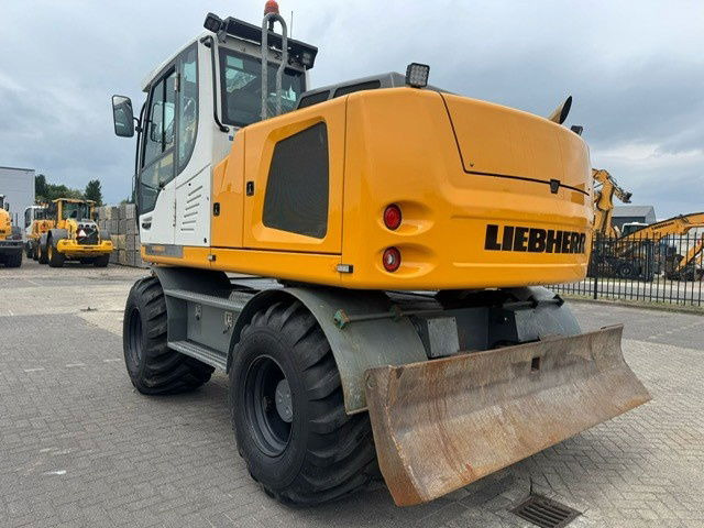 Liebherr A914 Litronic - Escavadeira de rodas: foto 2 Liebherr A914 Litronic - Escavadeira de rodas: foto 2