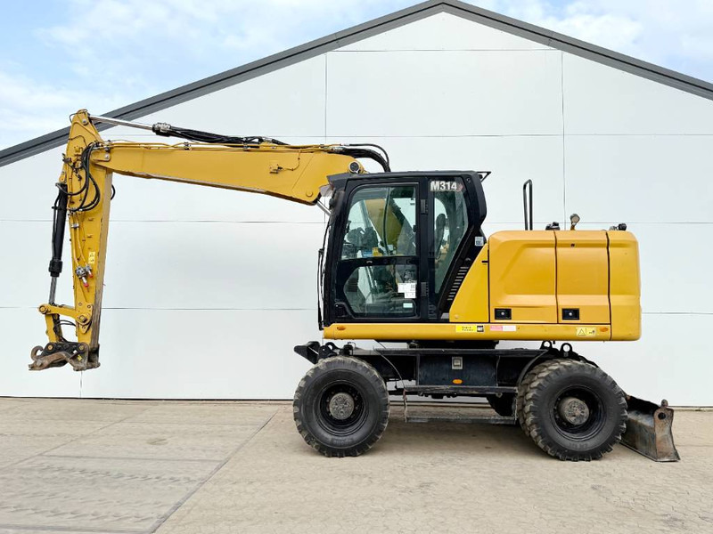Cat M314 next gen - Triple Boom / Automatic Greasing - Escavadeira de rodas: foto 1 Cat M314 next gen - Triple Boom / Automatic Greasing - Escavadeira de rodas: foto 1