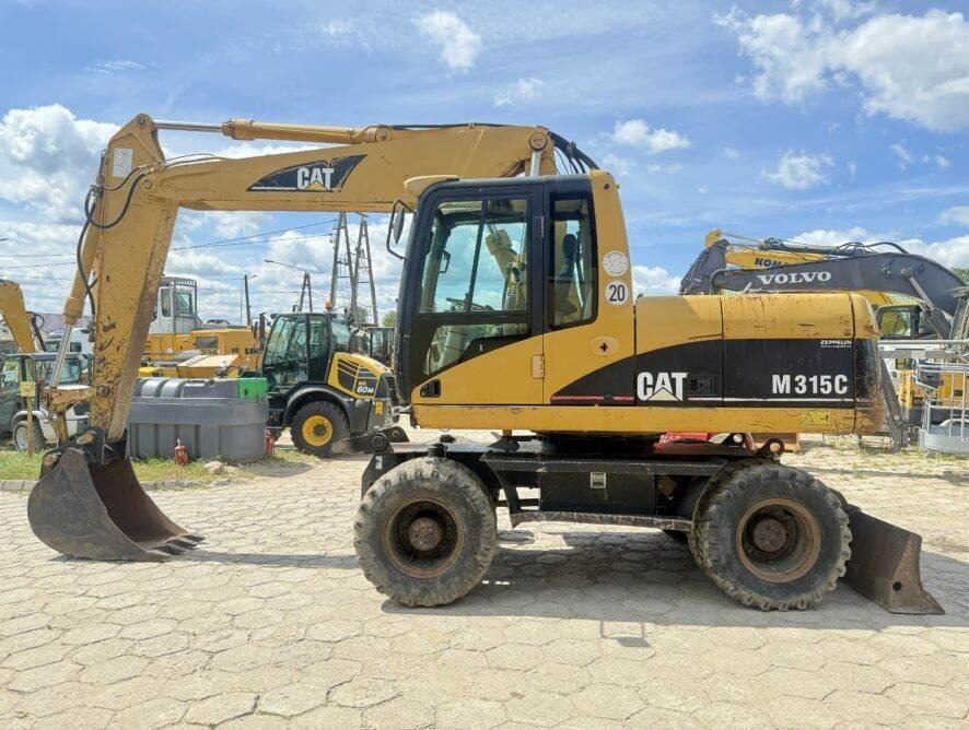 CAT M315C - Escavadeira de rodas: foto 1 CAT M315C - Escavadeira de rodas: foto 1