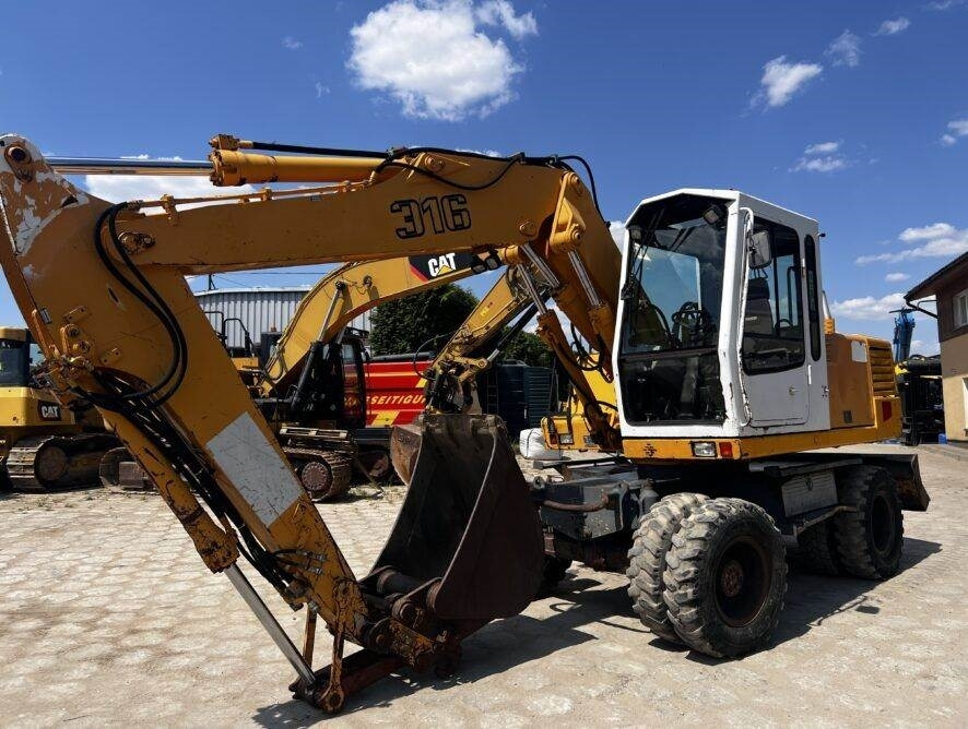 Liebherr A316 - Escavadeira de rodas: foto 1 Liebherr A316 - Escavadeira de rodas: foto 1