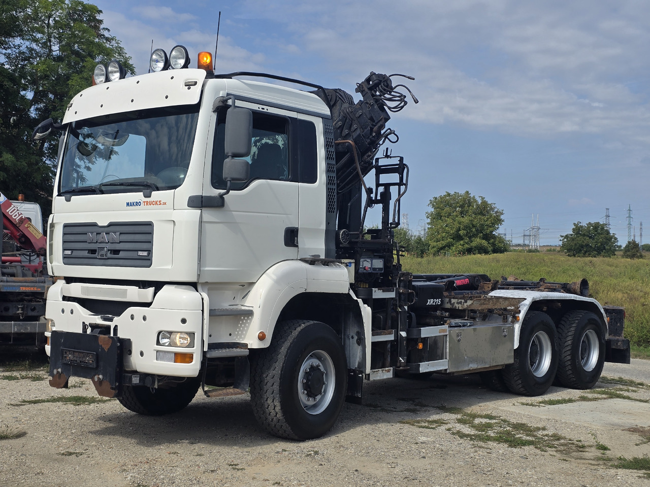 MAN TGA 26.440 6X6 / HOOK SYSTEM / HIAB 166D REMOTE SPECIAL PRICE ONLY THIS YEAR - Camião polibenne, Camião grua: foto 1 MAN TGA 26.440 6X6 / HOOK SYSTEM / HIAB 166D REMOTE SPECIAL PRICE ONLY THIS YEAR - Camião polibenne, Camião grua: foto 1