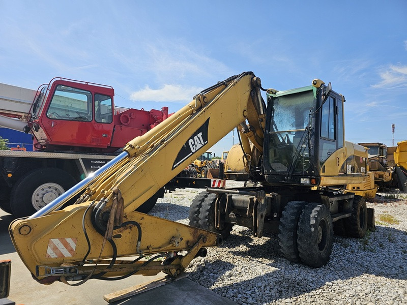 CATERPILLAR M318C - Escavadeira de rodas: foto 1 CATERPILLAR M318C - Escavadeira de rodas: foto 1