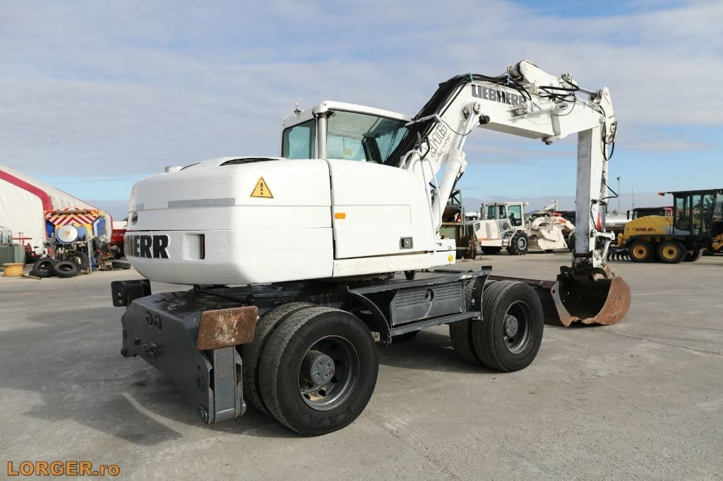 Liebherr A 316 Litronic  - Escavadeira de rodas: foto 3 Liebherr A 316 Litronic  - Escavadeira de rodas: foto 3