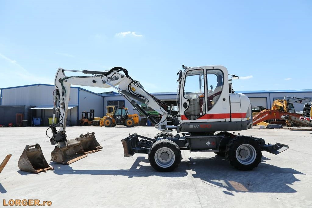 Wacker Neuson EW 100 - Escavadeira de rodas: foto 1 Wacker Neuson EW 100 - Escavadeira de rodas: foto 1