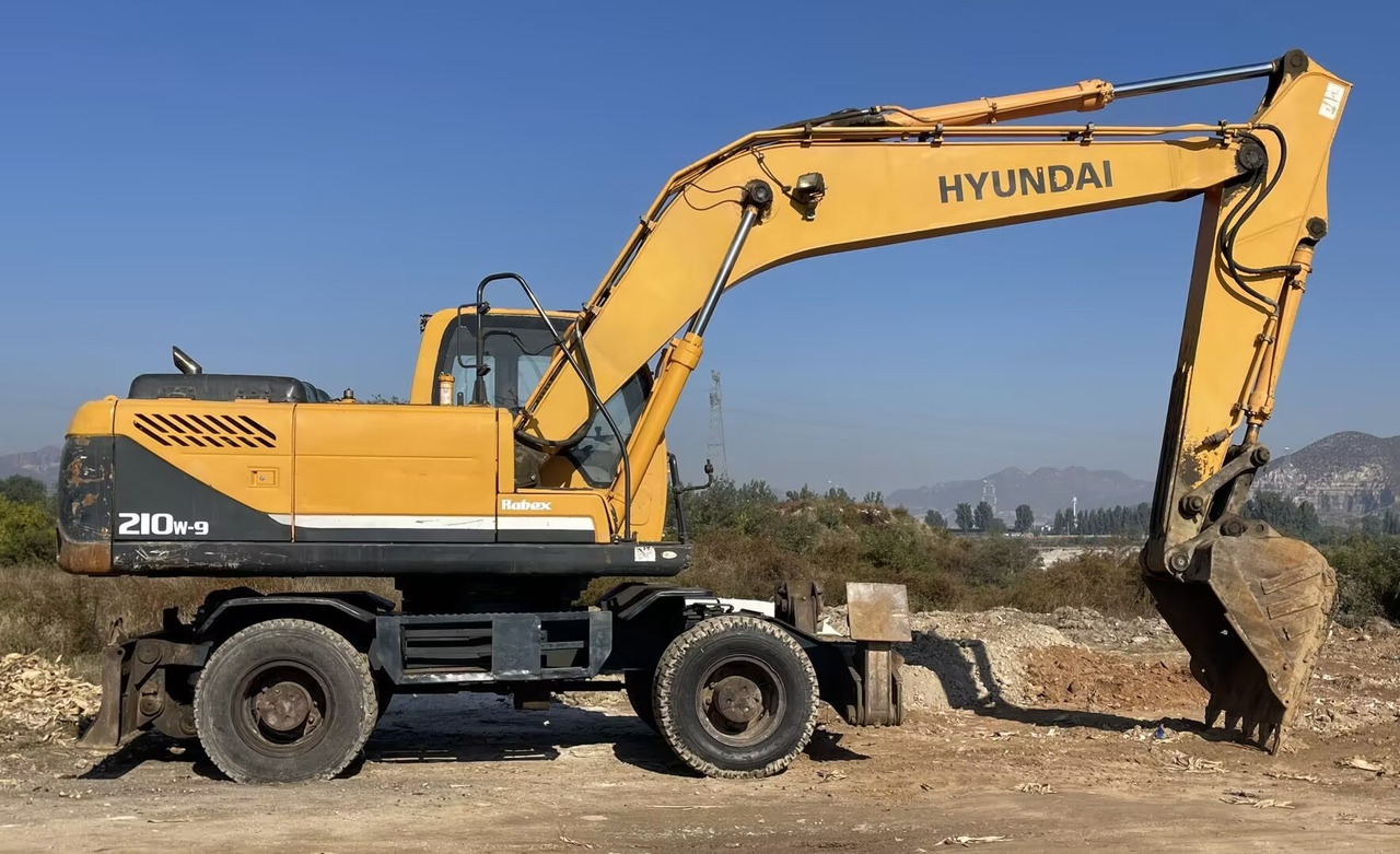 HYUNDAI 210W-9 - Escavadeira de rodas: foto 2 HYUNDAI 210W-9 - Escavadeira de rodas: foto 2
