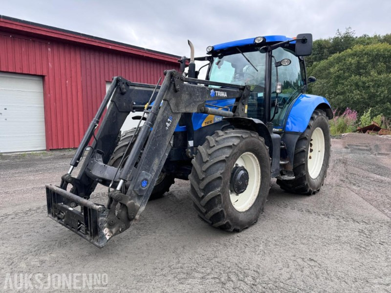 2012 New Holland T6050 med Trima +4.1P frontlaster og panser beskytter - 40 km/t - Trator: foto 1 2012 New Holland T6050 med Trima +4.1P frontlaster og panser beskytter - 40 km/t - Trator: foto 1