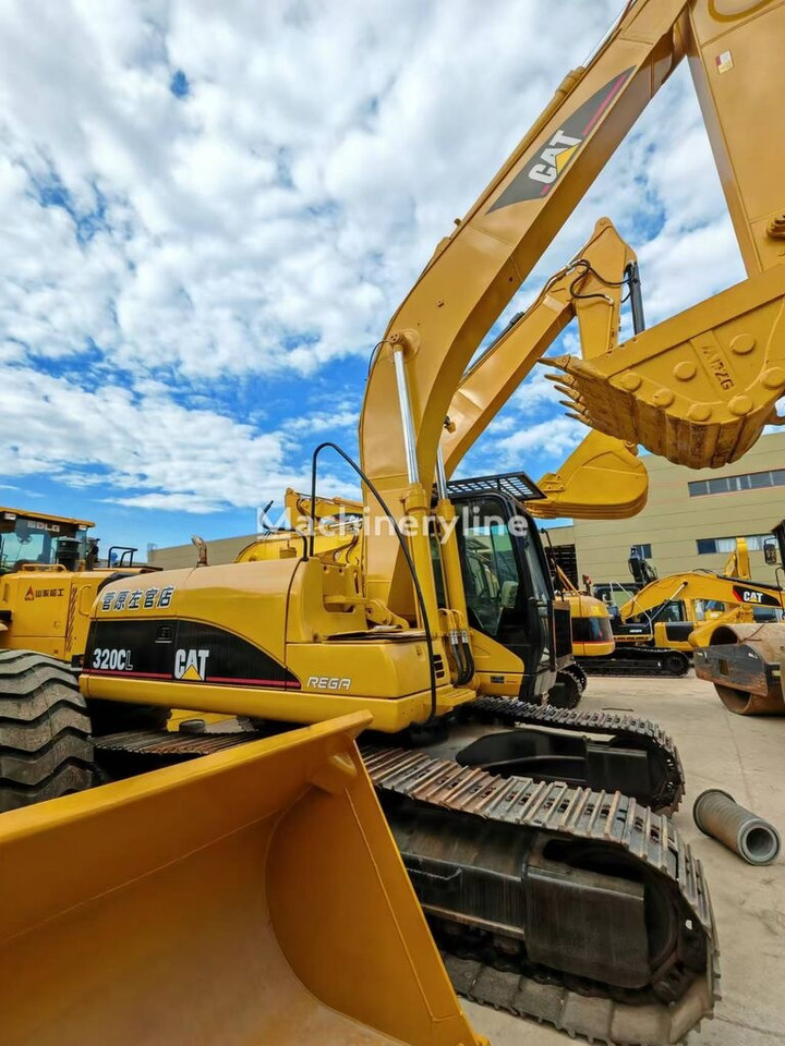Caterpillar 320CL - Escavadeira de rodas: foto 2 Caterpillar 320CL - Escavadeira de rodas: foto 2
